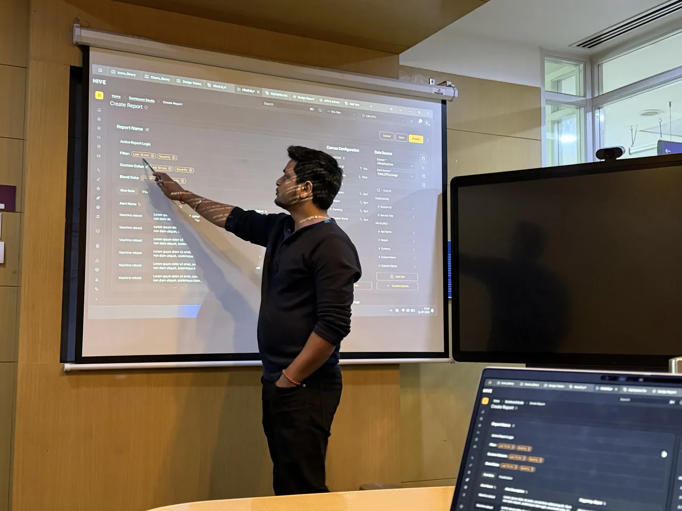 Anuraj explaining a screen to the room