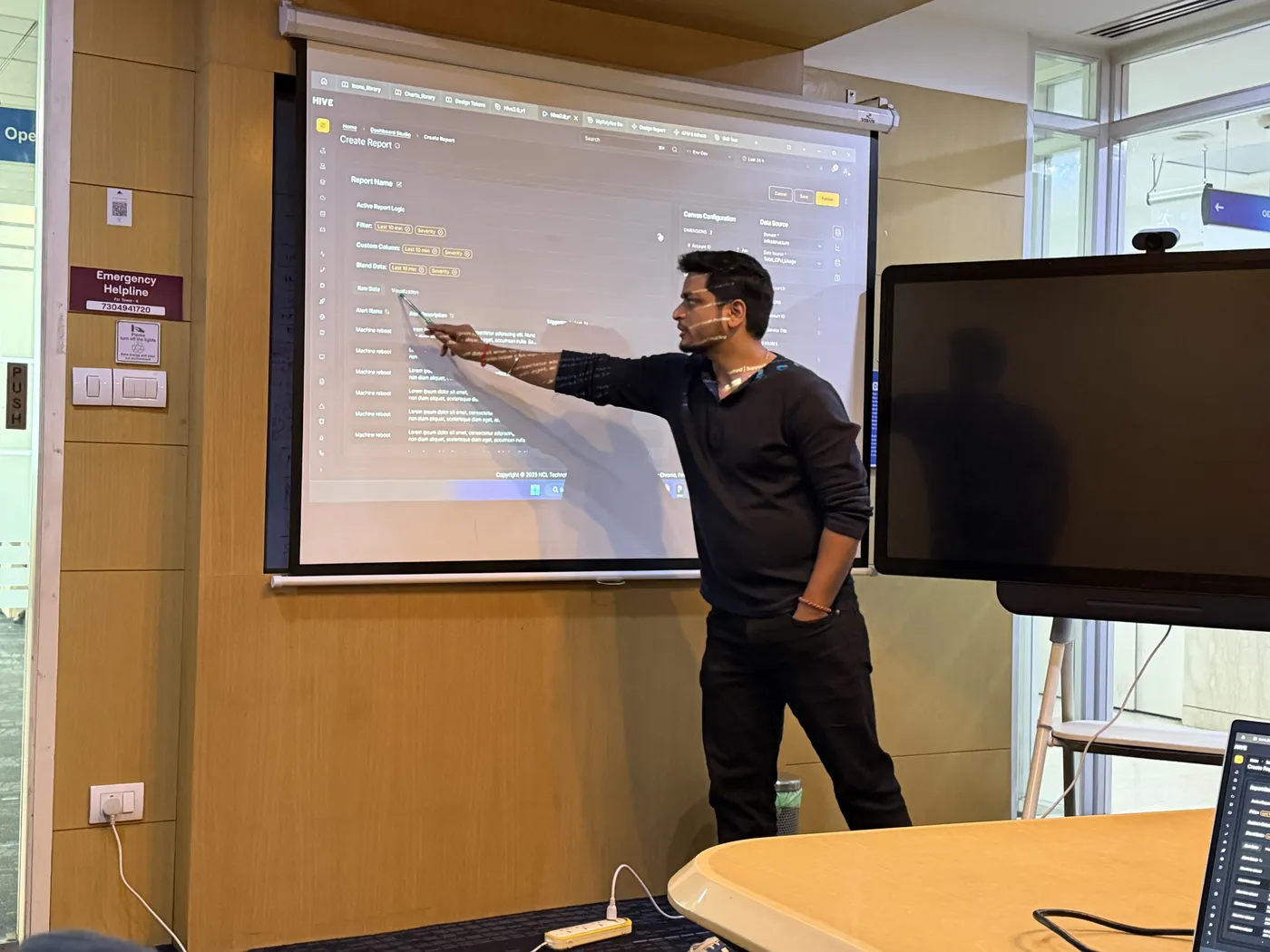 Anuraj pointing at the projector screen