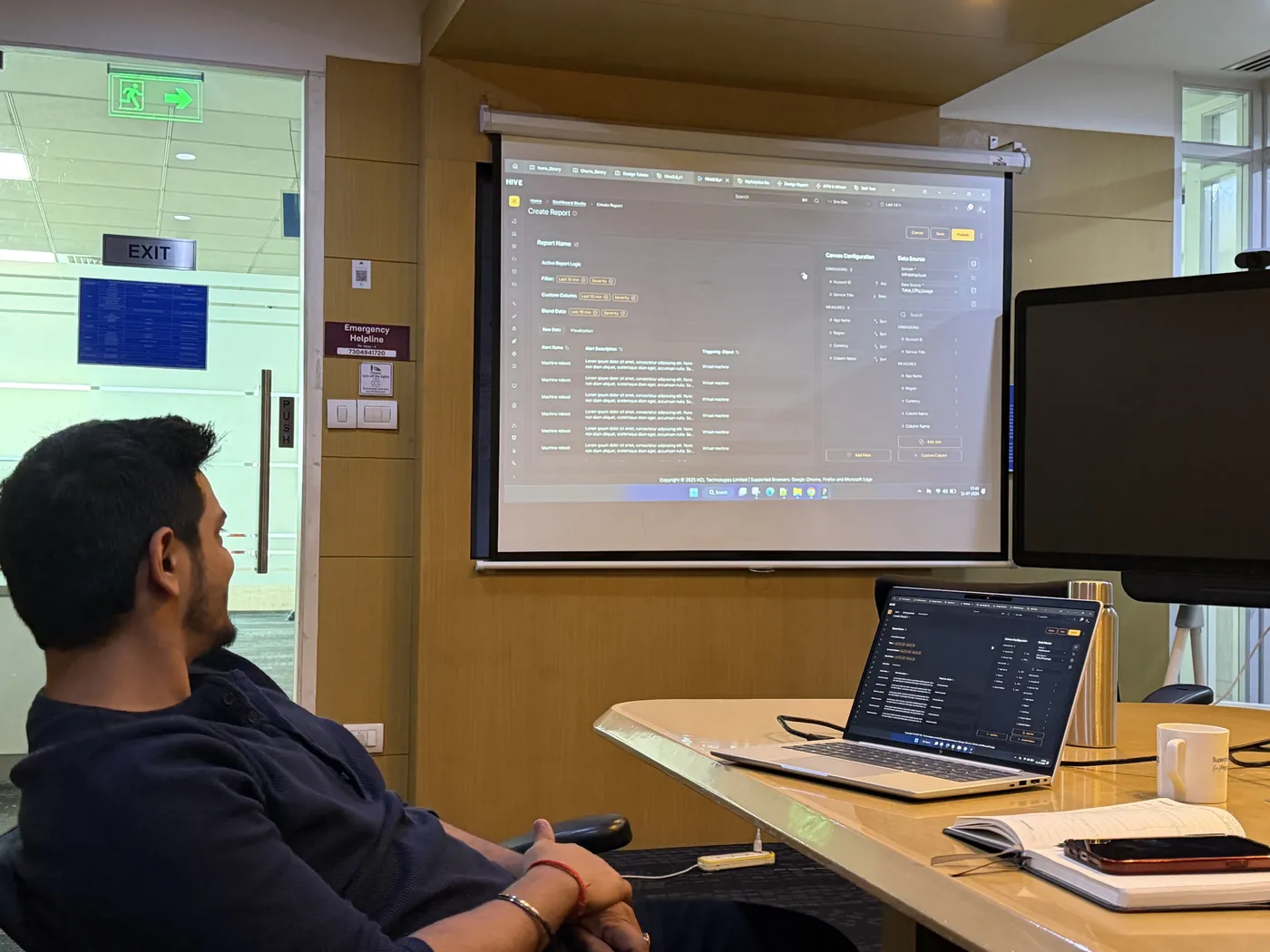 Anuraj watching a dashboard walkthrough from his desk