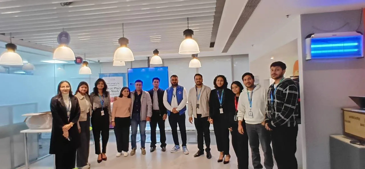 The team standing together in the office